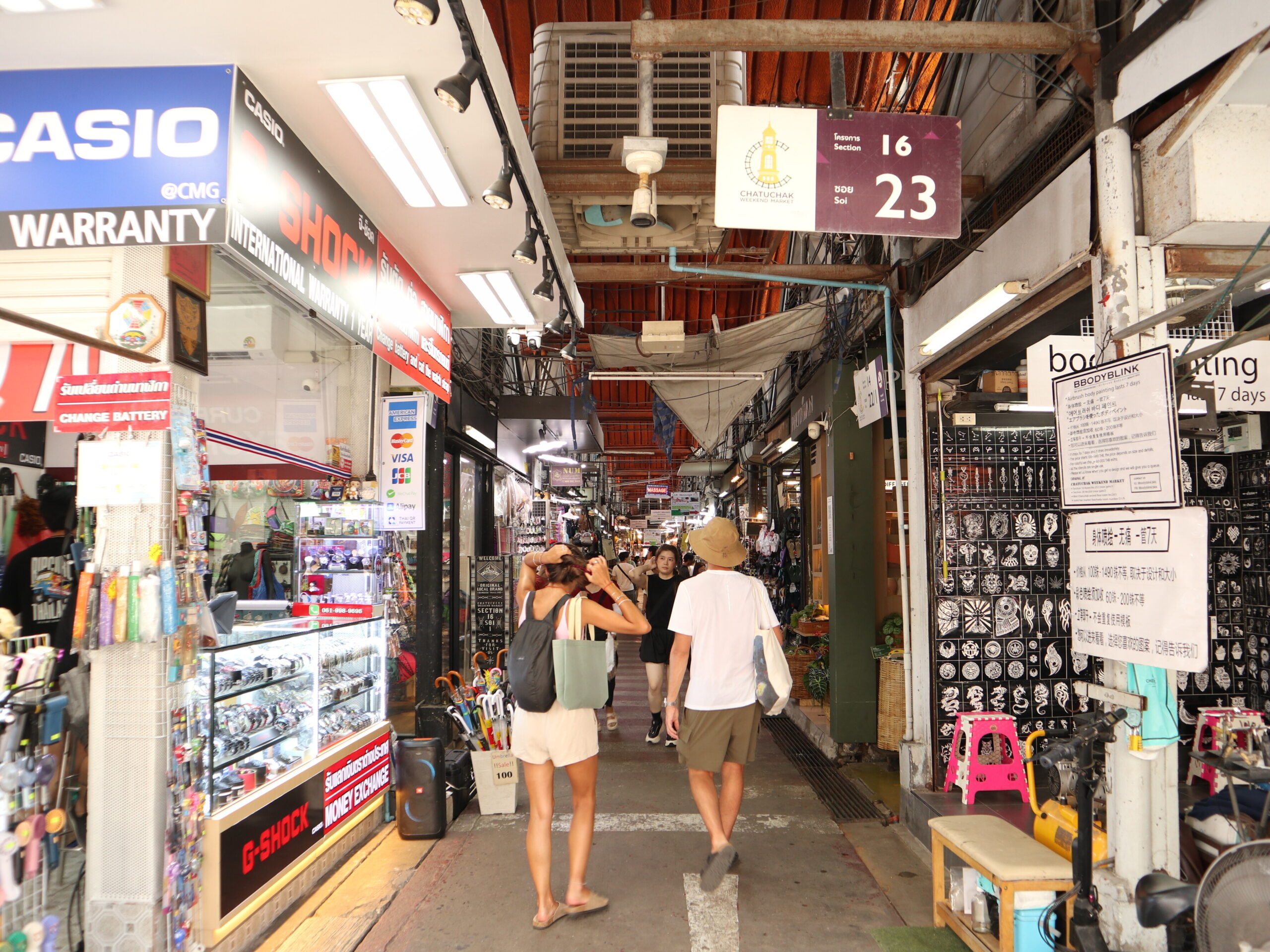 A market passage marked Section 16 and Soi 23 at Chatuchak