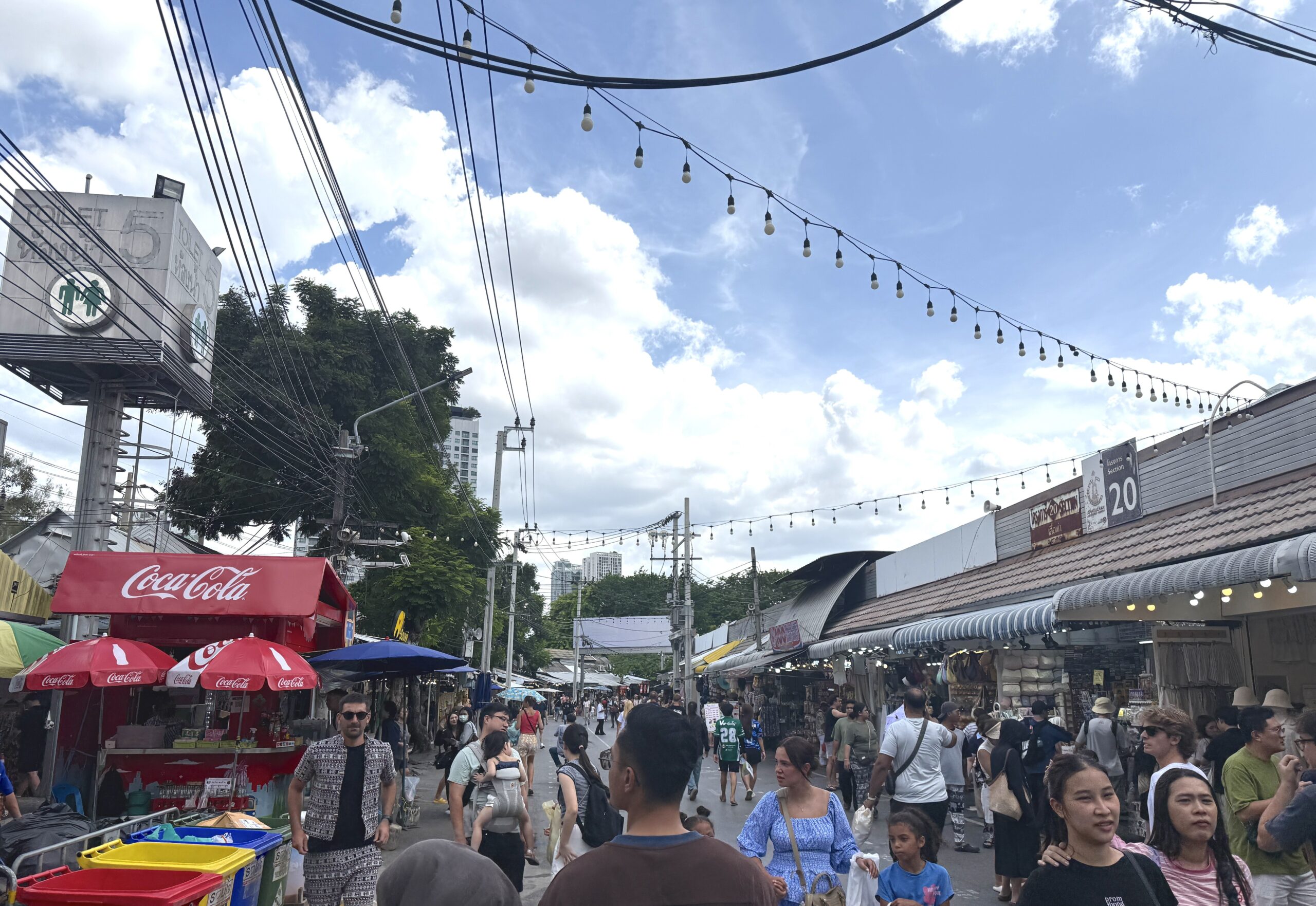 A busy Chatuchak street with a Section 20 sign