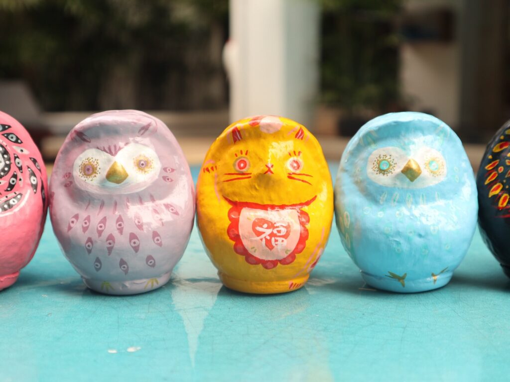 Purple owl, yellow cat and blue owl Daruma art pieces