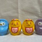 Four differently painted Daruma art pieces by Kotori/KTR