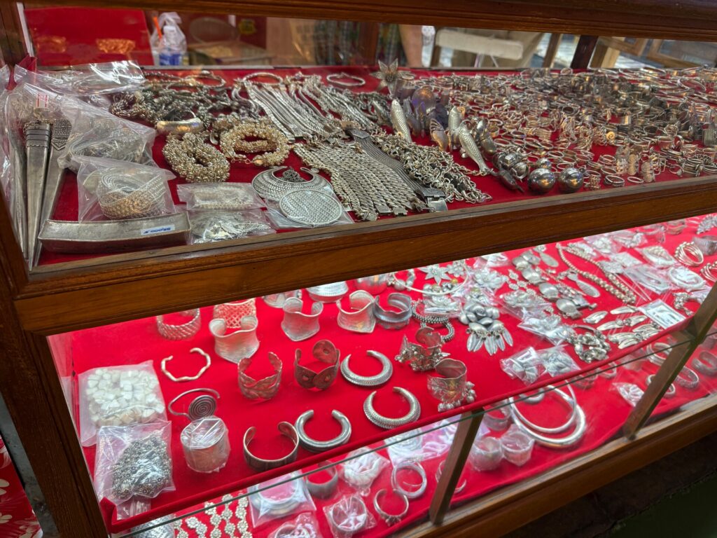 Wide selection of Karen silver jewellery in a glass display case