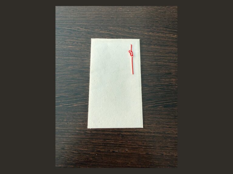 Yanagiu washi pochi-bukuro with a red-and-white knot, shown in full.