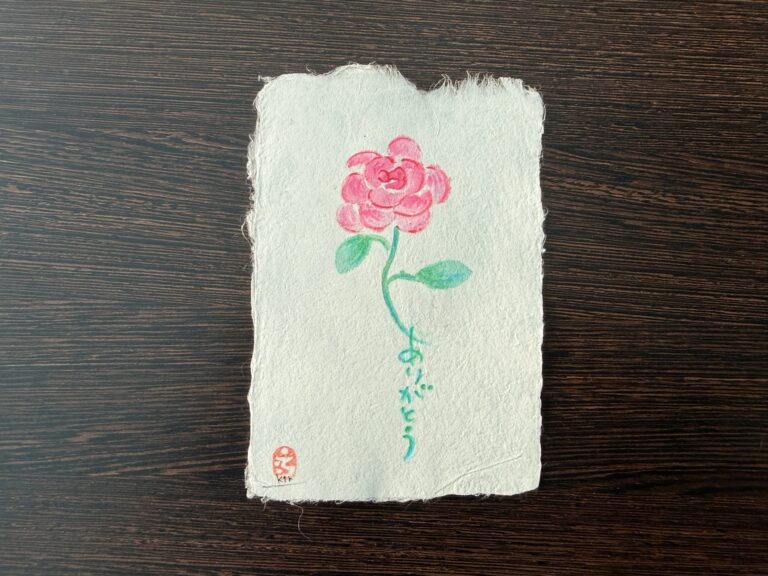 A pink flower and Japanese thank-you lettering on Yanagiu washi.