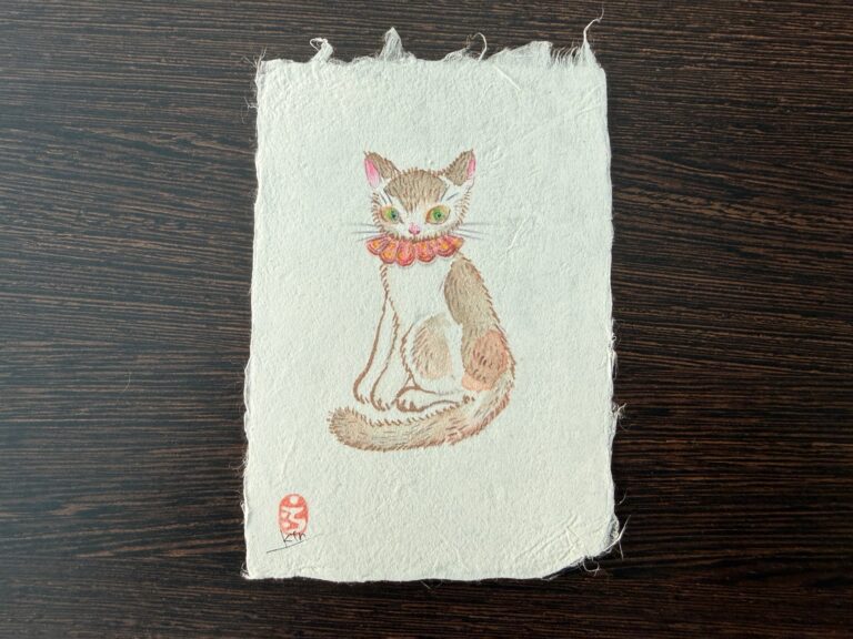 A seated cat illustration on Yanagiu washi.